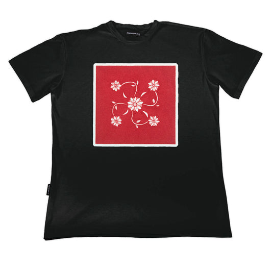 Black t-shirt with a red square and floral design on a white background by www.tigerstripes.co
