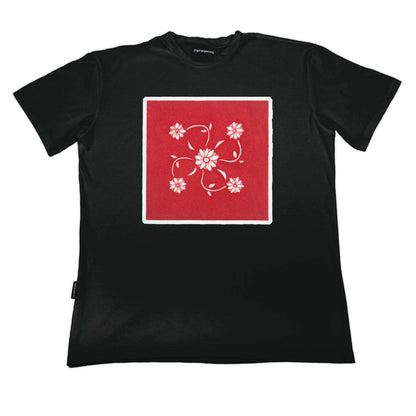 Black t-shirt with a red square and floral design on a white background by www.tigerstripes.co