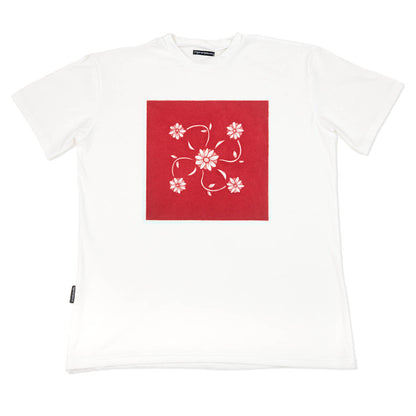 White t-shirt with a red square and floral design on a white background by www.tigerstripes.co